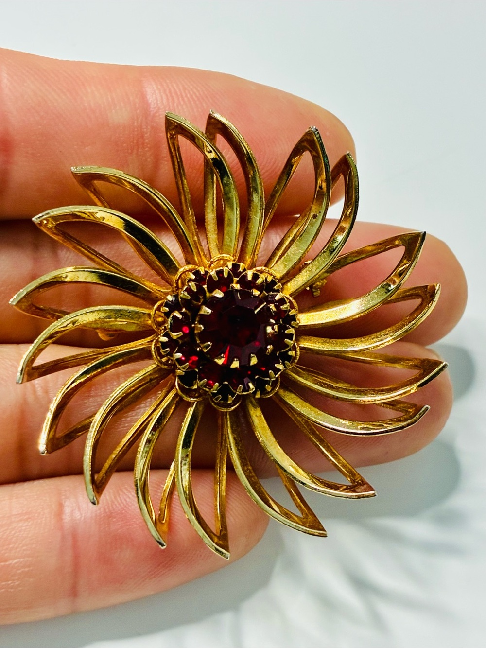 Sarah Coventry Gold-tone Sunburst Brooch with Deep Red Center